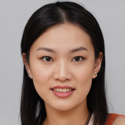 Joyful asian young-adult female with medium  black hair and brown eyes