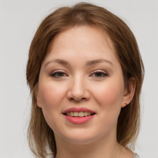 Joyful white young-adult female with long  brown hair and grey eyes