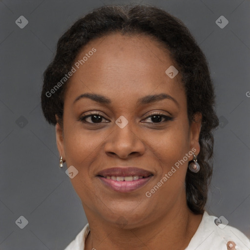 Joyful black adult female with short  brown hair and brown eyes