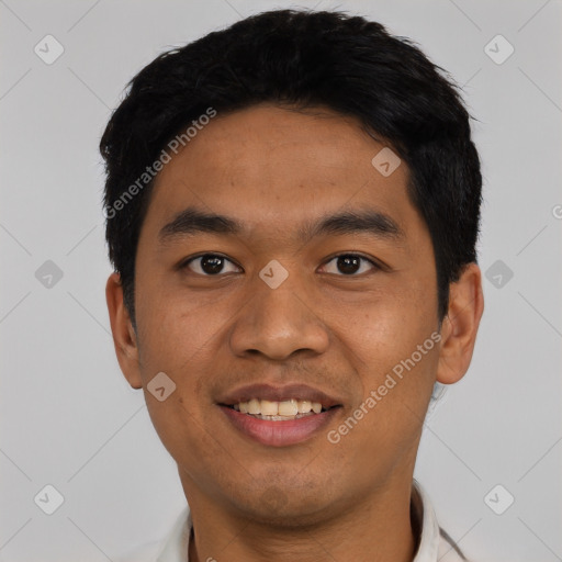 Joyful latino young-adult male with short  black hair and brown eyes