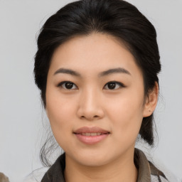 Joyful asian young-adult female with medium  black hair and brown eyes