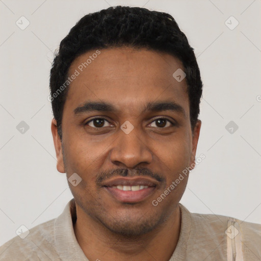 Joyful black young-adult male with short  black hair and brown eyes