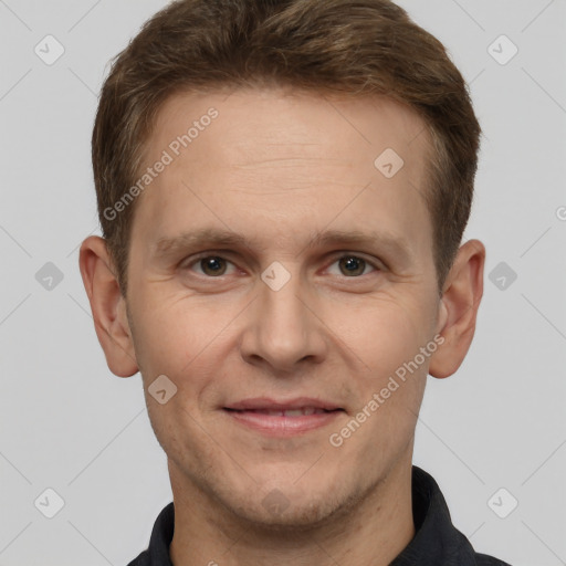 Joyful white adult male with short  brown hair and grey eyes