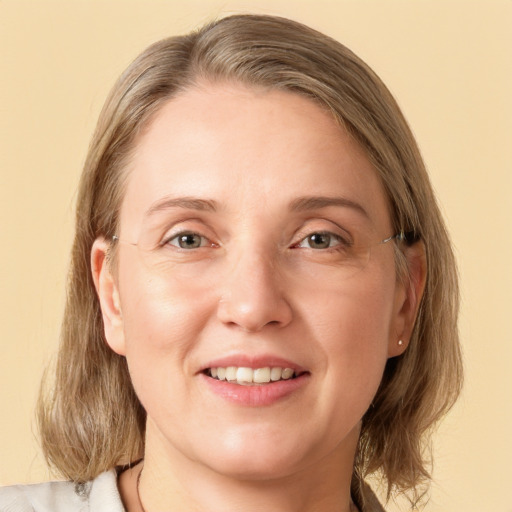 Joyful white young-adult female with medium  brown hair and blue eyes