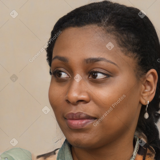 Joyful black young-adult female with medium  black hair and brown eyes