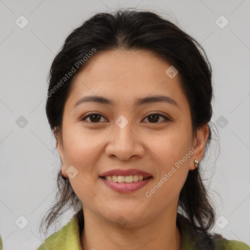 Joyful latino young-adult female with medium  brown hair and brown eyes