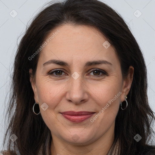 Joyful white adult female with long  brown hair and brown eyes