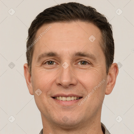 Joyful white adult male with short  brown hair and brown eyes