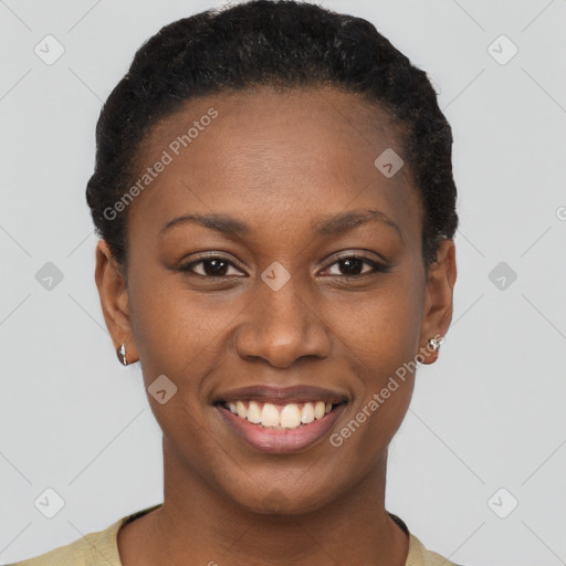 Joyful black young-adult female with short  brown hair and brown eyes