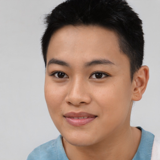 Joyful asian young-adult female with short  black hair and brown eyes