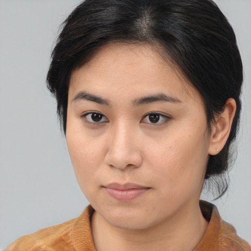 Neutral asian young-adult female with medium  brown hair and brown eyes