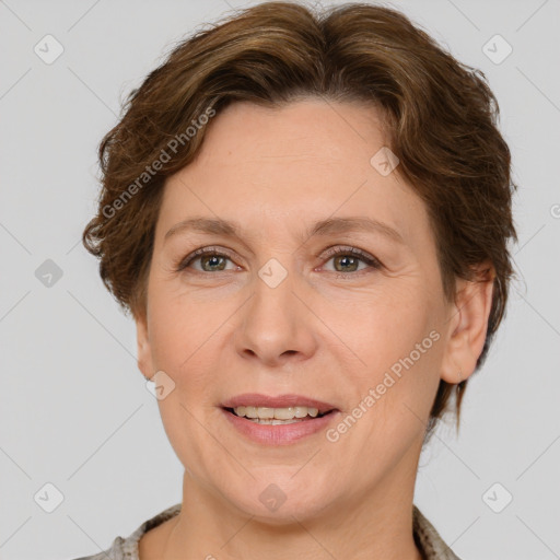 Joyful white adult female with short  brown hair and grey eyes