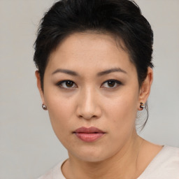 Neutral asian young-adult female with short  brown hair and brown eyes