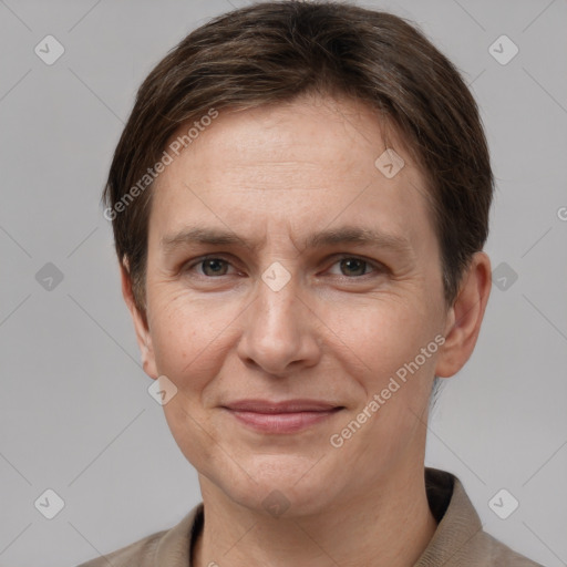 Joyful white adult female with short  brown hair and grey eyes