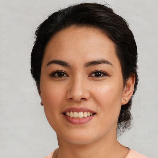 Joyful asian young-adult female with medium  brown hair and brown eyes