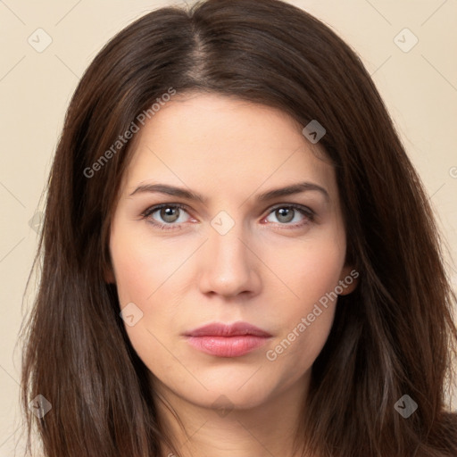 Neutral white young-adult female with long  brown hair and brown eyes