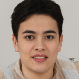 Joyful asian young-adult male with short  brown hair and brown eyes