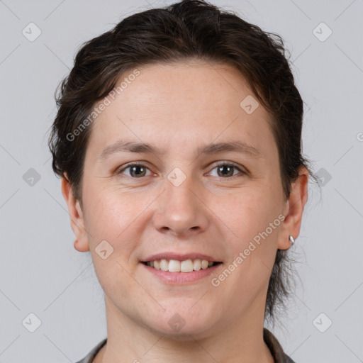 Joyful white young-adult female with short  brown hair and brown eyes