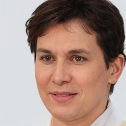 Joyful white adult female with short  brown hair and brown eyes