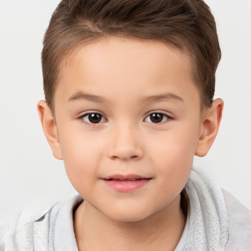 Joyful white child male with short  brown hair and brown eyes