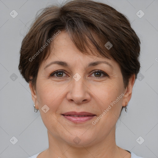 Joyful white adult female with short  brown hair and brown eyes