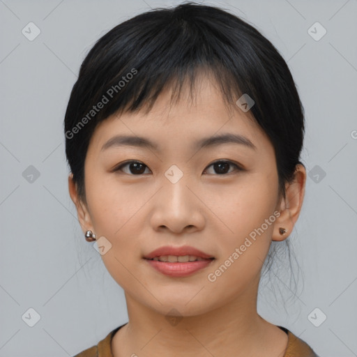 Joyful asian young-adult female with medium  black hair and brown eyes