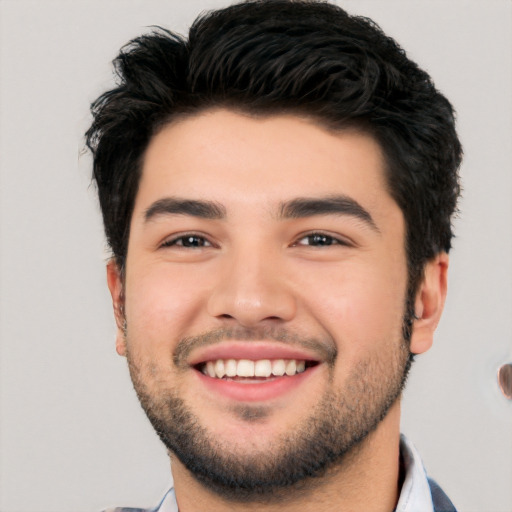 Joyful white young-adult male with short  black hair and brown eyes