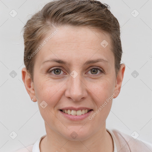 Joyful white adult female with short  brown hair and grey eyes