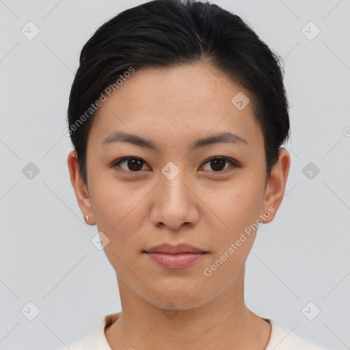 Joyful asian young-adult female with short  black hair and brown eyes