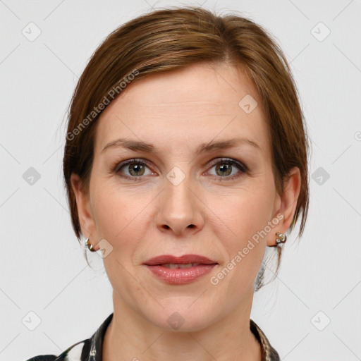 Joyful white adult female with medium  brown hair and grey eyes