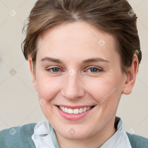 Joyful white young-adult female with short  brown hair and grey eyes