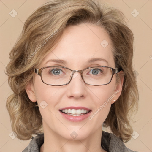 Joyful white adult female with medium  brown hair and blue eyes