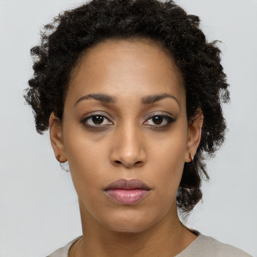 Neutral black young-adult female with short  brown hair and brown eyes