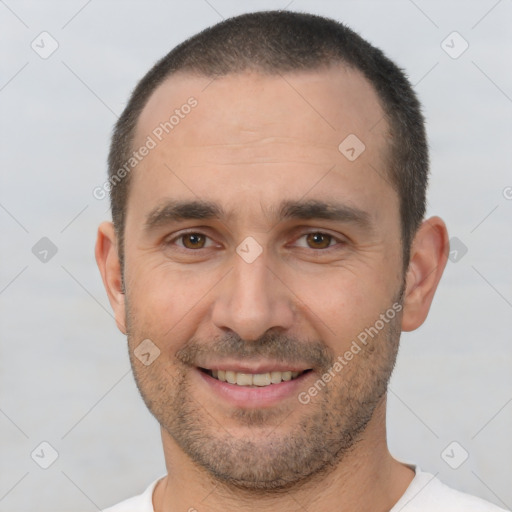 Joyful white adult male with short  brown hair and brown eyes