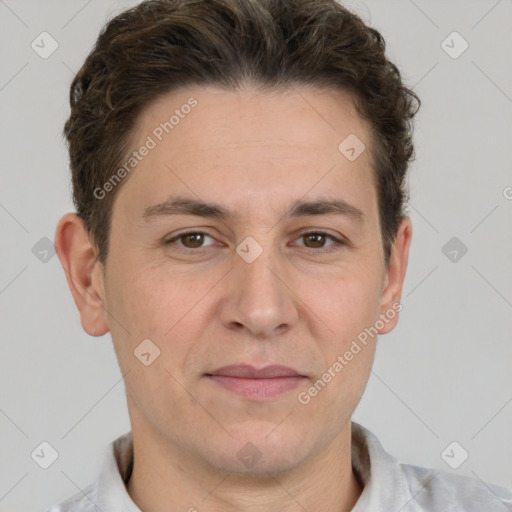 Joyful white adult male with short  brown hair and grey eyes