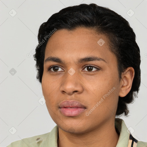 Joyful latino young-adult female with short  black hair and brown eyes