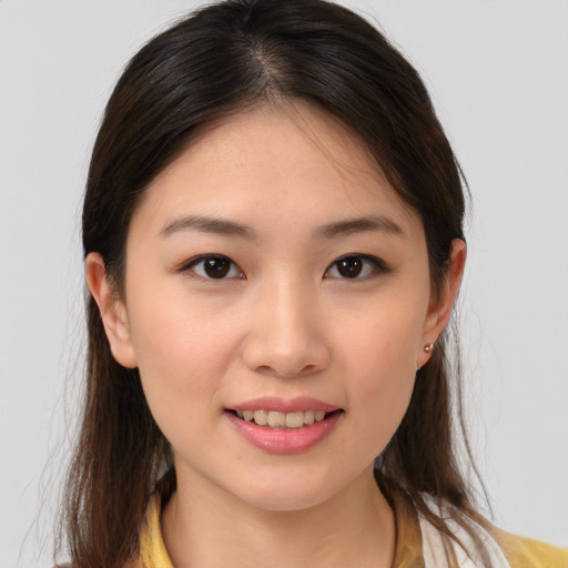 Joyful white young-adult female with medium  brown hair and brown eyes