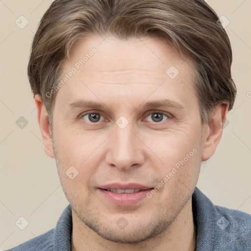 Joyful white adult male with short  brown hair and grey eyes