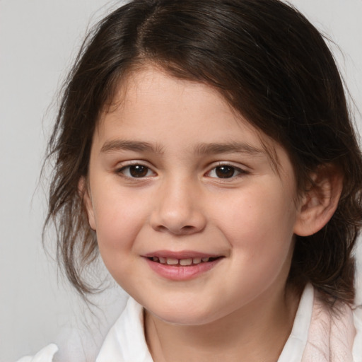 Joyful white child female with medium  brown hair and brown eyes