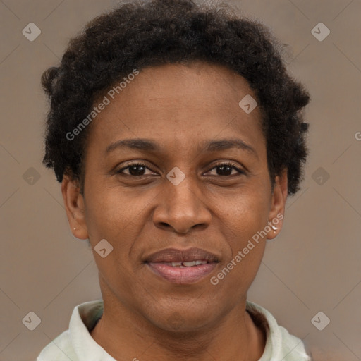 Joyful black adult female with short  brown hair and brown eyes