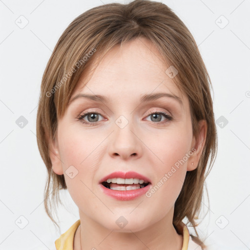 Joyful white young-adult female with medium  brown hair and blue eyes