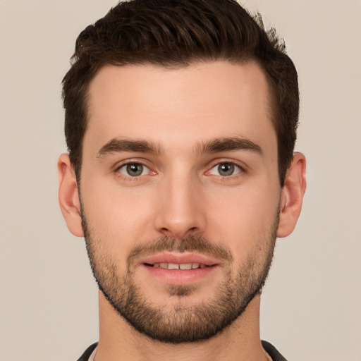 Joyful white young-adult male with short  brown hair and brown eyes