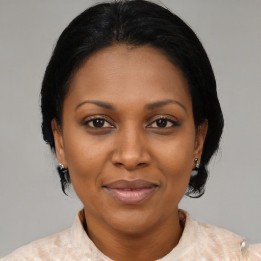 Joyful latino adult female with medium  black hair and brown eyes
