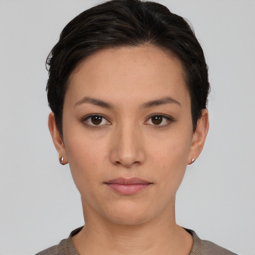 Neutral white young-adult female with short  black hair and brown eyes