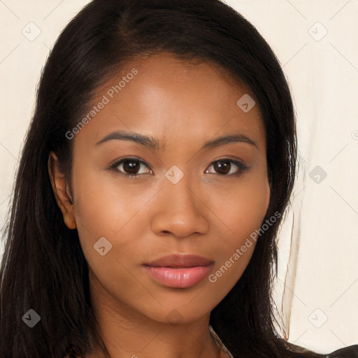 Joyful latino young-adult female with long  brown hair and brown eyes