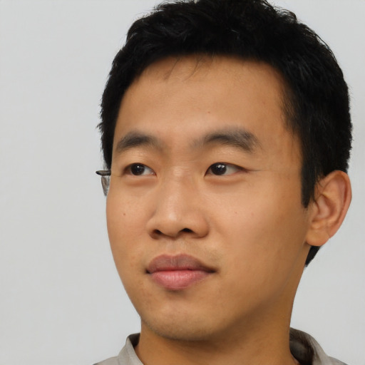 Neutral asian young-adult male with short  black hair and brown eyes