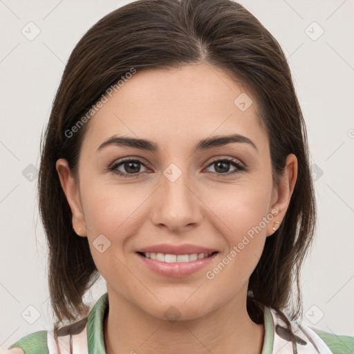 Joyful white young-adult female with medium  brown hair and brown eyes