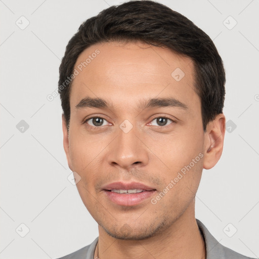 Joyful white young-adult male with short  black hair and brown eyes