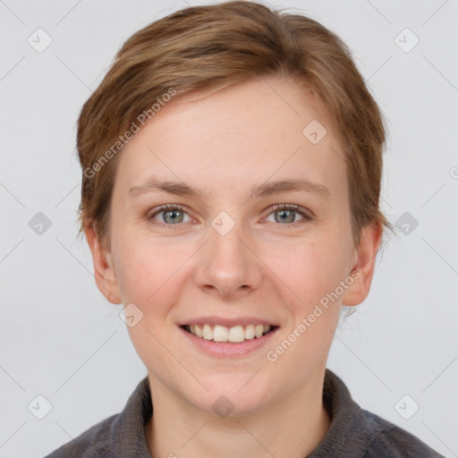 Joyful white young-adult female with short  brown hair and grey eyes