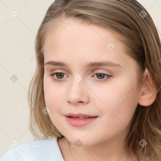 Joyful white child female with long  brown hair and brown eyes